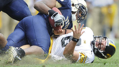 Pitt's Tony Tucker wrestles the ball from Iowa's Jake Christensen late in the Panthers' 21-20 win Sept. 20.