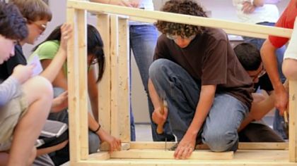 Michael Trimm, a student at Hampton Middle School, hammers a nail during construction of a doghouse for the Western Pennsylvania Humane Society.