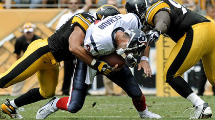 James Farrior, left, and Nick Eason take down Texans quarterback Matt Schaub in the third quarter Sunday.