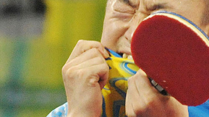 BEIJING -- Gold medalist Ma Lin of China celebrates after winning the men's table tennis singles against a teammate.
