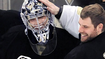 Penguins goalie Marc-Andre Fleury is congratulated by Ty Conklin after a shutout against the Rangers Sunday afternoon.