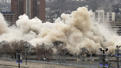 The Downtown landmark collapses in a cloud of dust and rubble.