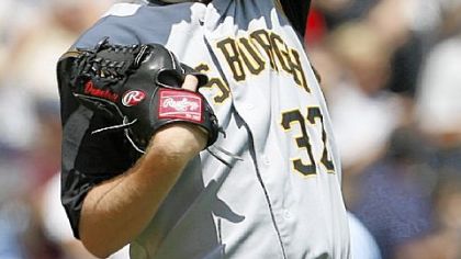 Pirates starting pitcher Phil Dumatrait wipes his face after the White Sox's Jermaine Dye's solo home run in the third inning in Chicago. Dumatrait gave up nine runs in five innings.