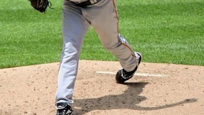 Pirates' starting pitcher Zach Duke delivers against the Colorado Rockies at Coors Field.