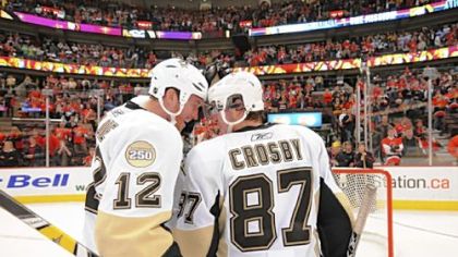 Ryan Malone and Sidney Crosby bask in the Penguins' series sweep of Ottawa last night at Scotiabank Place.