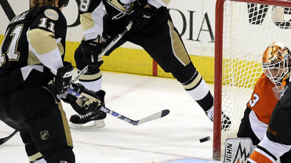Penguins Jordan Staal scores on Flyers Martin Biron in the second period Sunday.