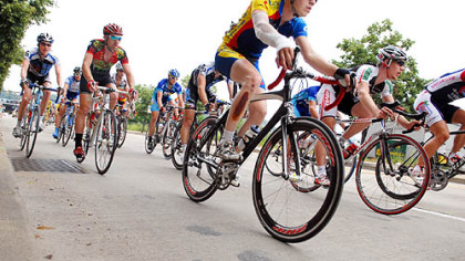Cyclists race down Hot Metal Street on the South Side yesterday in the Tour of Pennsylvania. Canadian David Veilleux crossed the finish line first to win Stage 5 of the 420-mile race, which ends Downtown today.