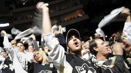 Penguins fans cheer on their team as they take on the Flyers Sunday.