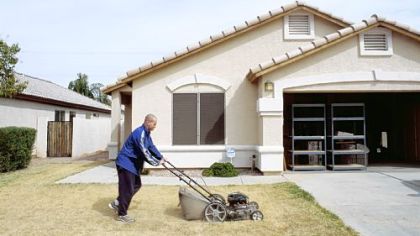 Love of lawn: Greg Stimac photographed this image in Chandler, Ariz.; it's part of his "Mowing the Lawn" series.