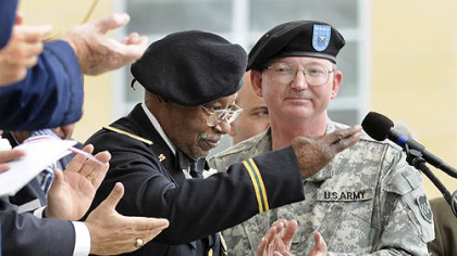 T. Rafael Lee, 82, salutes the crowd as he is honored during the rededication ceremony of the Boulevard of the Allies.  Mr. Lee, who in World War II was a lieutenant colonel in the all-black Tuskegee Airmen flying unit, lives in New Castle.