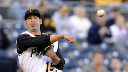 Jose Bautista tries to throw out the Brewers' Mike Cameron, but Cameron narrowly beat it out for an infield single in the first inning.