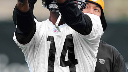 Steelers No. 2 pick receiver Limas Sweed gets a few pointers from veteran Hines Ward at minicamp.