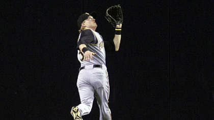 Pirates centerfielder Nate McLouth tracks down a deep fly off the bat of San Diego Padres' Luis Rodriguez in the first inning of last night's game in San Diego. (AP Photo/Lenny Ignelzi)