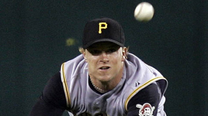 Nate McLouth dives for a ball hit by Cesar Izturis in the fifth inning last night at Busch Stadium.