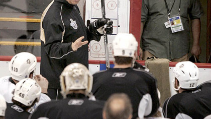 Penguins coach Michel Therrien talks to his players at practice yesterday at Joe Louis Arena in Detroit. After being shut out, 4-0, in Game 1 of the Stanley Cup final, Therrien is shifting the Penguins' lines around for tonight's game.