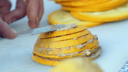 Laura Miller prepares a Summer Stack, squash layered with olives and goat cheese.