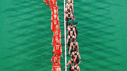 The teams walk in prior to the women's field hockey match between Germany and New Zealand.