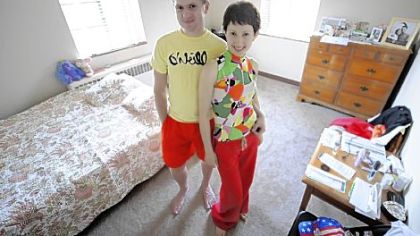 Iryna Maskaliova and her husband, Artsiom Zhdanovich, both 29, stand Wednesday in their Mt. Lebanon bedroom, which is filled with furniture from Off the Floor Pittsburgh.