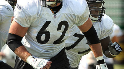 Center Justin Hartwig looks for the defense.
