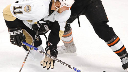 Jordan Staal takes the puck away from the Flyers' Randy Jones.