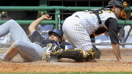 Mets' Carlos Beltran slides safely into home plate against Pirates' Raul Chavel in the fourth inning.