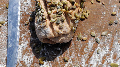 A Honey Wheat Loaf with roasted pumpkin seeds, by Josh Tonies.