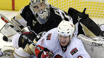 Ottawa's Shean Donovan goes down into Penguins goalie Marc-Andre Fleury in the third period of Game 2 Friday night. Can he and the Senators get back up? History says no.