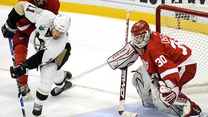 Jordan Staal tries to get a shot on Red Wings goalie Chris Osgood.