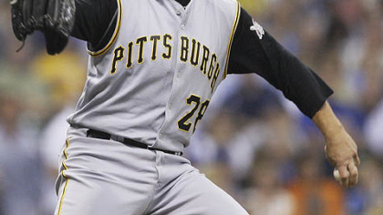 Paul Maholm throws during the first inning against the Brewers last night at Miller Park.