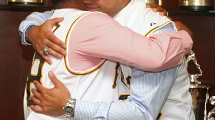Pedro Alvarez embracing his father after signing his contract yesterday at PNC Park.