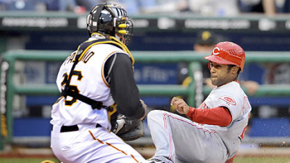 Ronny Paulino tags out Cincinnati's Corey Patterson, who tried to score on a fly ball to Pirates right fielder Xavier Nady in the first inning last night at PNC Park.