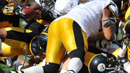 Steelers running back Rashard Mendenhall is stopped short during the goal-line drills yesterday at Saint Vincent College in Latrobe.