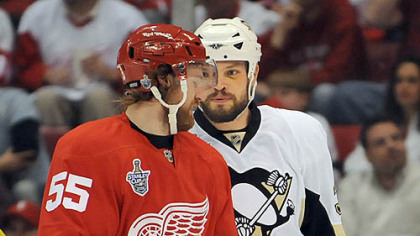 Jarkko Ruutu has words with Detroit's Nicklas Kromwell early in last night's game. The Red Wings, however, had the final say.