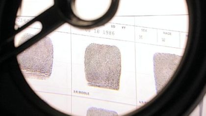 Fingerprints from a Mt. Lebanon burglary are lined up for fingerprint analyst Wayne Reutzel's practiced eyes in the office he shares at Pittsburgh Police headquarters. Mr. Reutzel, who used to work at the Allegheny County Crime Lab, is working on a pilot program for the Allegheny County Chiefs of Police to lower the turnaround time for fingerprint analysis.