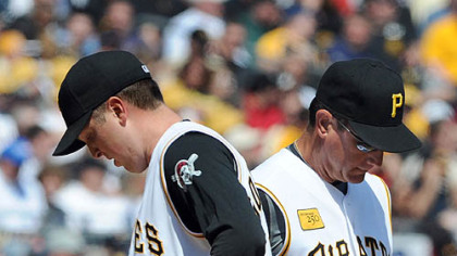 Manager John Russell takes the ball from starter Tom Gorzelanny in the third inning Monday after the left-hander gave up seven runs on the six hits against the Cubs. Gorzelanny's fastest pitch against Chicago reached 94 mph.