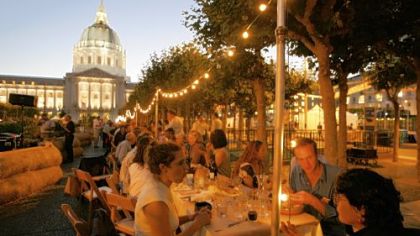 Diners finish their dessert course during the Come to the Table opening dinner of Slow Food Nation outside City Hall in San Francisco.