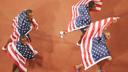 BEIJING -- U.S. athletes from top left, counterclockwise, David Neville, Lashawn Merritt, Angelo Taylor, and Jeremy Wariner wave flags after winning gold in the men's 4x400m relay final.