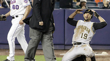 Jose Bautista can't believe umpire Hunter Wendelstedt calls him out after Bautista tried to score from third in the seventh inning after the ball got away from the catcher.