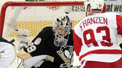 The Red Wings' Johan Franzen scores a goal on Penguins Marc-Andre Fleury in the second period.