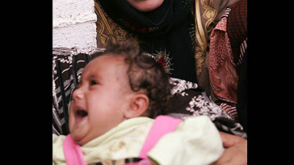 SUKKARIYEH, Syria -- The sister of Syrian Faysal el-Abdallah, who died Oct. 26, when U.S. military helicopters launched an attack on Syrian territory, mourns during his funeral procession about eight miles inside the Syrian border, Oct. 27. Four U.S. military helicopters flying along the Euphrates River struck an area along Syria''s border with Iraq, killing eight people, the Syrian government said, condemning what it called "serious aggression."