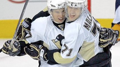 Sidney Crosby and Evgeni Malkin celebrate Monday in Buffalo.