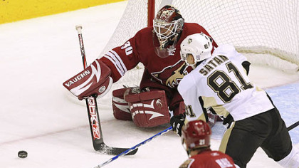 Penguins' Miroslav Satan gets his shot blocked by Coyotes' Ilya Bryzgalov, in the first period.