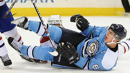Sidney Crosby is pulled to the ice by Montreal's Josh Gorges last night at Mellon Arena.