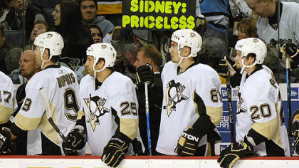 From left, Pittsburgh Penguins Pascal Dupuis, Maxime Talbot, Miroslav Satan, of Slovakia, and Janne Pesonen, of Finland, wait to congratulate teammate Tyler Kennedy on his goal against the Buffalo Sabres during the first period of last night's game in Buffalo.