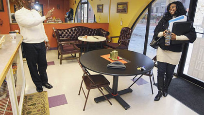 Kevin Mickens waves goodbye to De'netta Benjamin at the Koko Latte's Coffee, Tea & Eatery in East Liberty.  They both work in the medical building where the shop in located on the first floor.