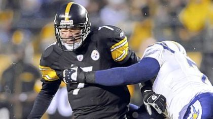 Ben Roethlisberger tries to shake off San Diego's Jacques Cesaire. Roethlisberger was sacked four times.