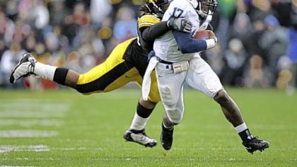 Iowa's Adrian Clayborn tracks down   quarterback Daryll Clark early in Saturday's game in Iowa City, Iowa.