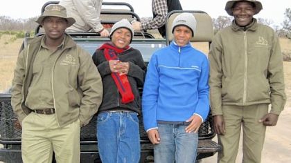 Kea and Lucky, center, with the driver and spotter from the safari.