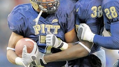 Pitt's Jovani Chappel is congratulated by teammates Greg Williams and Eric Thatcher after his fourth quarter interception against West Virginia yesterday at Heinz Field.