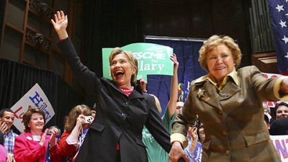 Democratic presidential hopeful, Sen. Hillary Rodham Clinton, D-N.Y.,waves to the crowd as  Pennsylvania Lt. Gov. Catherine Baker Knoll guides her to center stage during a campaign stop at The Forum, Tuesday, March 11, 2008, in Harrisburg.